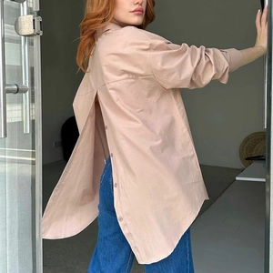 Women's light brown long-sleeved shirt with a unique buttoned back-slit design