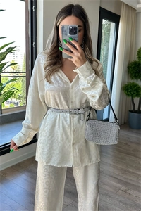 Detail of cream white satin long sleeve shirt and pants with leopard jacquard texture