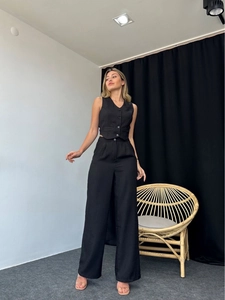 Detailed full view of chic black two-piece set featuring V-neck vest and wide-leg trousers