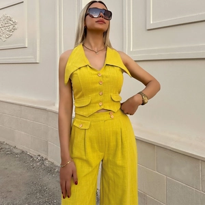 Chic bright yellow two-piece summer set with halter vest and high-waist wide-leg pants
