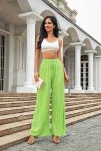 Detail of high waisted lime green pleated wide leg pants with elastic drawstring waist