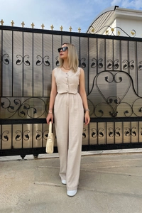 Chic women's two-piece set featuring a beige cropped vest and high-waist wide-leg pants