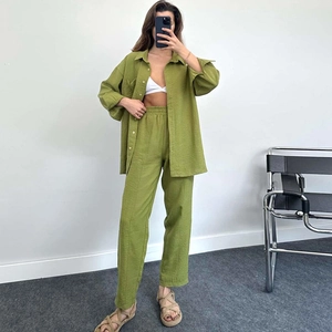 Women's 2-piece lounge set with long sleeve button-up shirt and pleated pants in olive green