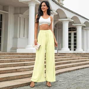 Pale yellow high-waisted wide-leg pleated trousers with adjustable drawstring waist