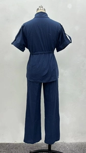 Detail of navy casual set showing drawstring waist and breathable cotton linen fabric