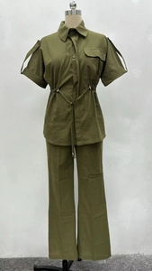 Detail of army green two-piece utility set with drawstring waist and shoulder epaulettes