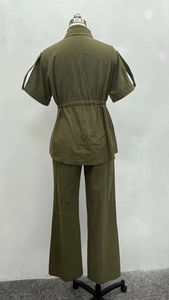 Detail of olive green two-piece set featuring drawstring waist and textured fabric back view