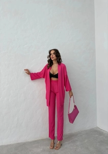 Detailed texture of hot pink two-piece set featuring ribbed fabric and elastic waist