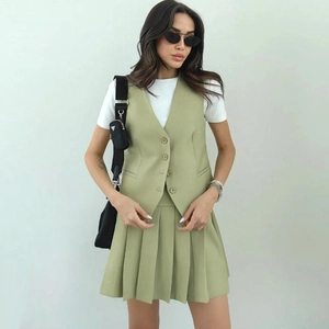 Women's avocado green two-piece set featuring a V-neck vest and high-waist pleated skirt
