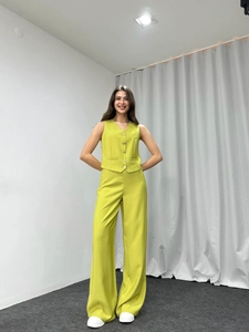 Close-up of fruit green two-piece set featuring V-neck vest and wide-leg trousers