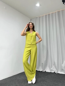 Lime green two-piece set featuring a V-neck vest and high-waist wide-leg trousers