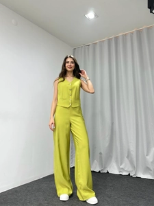 Lime green two-piece set featuring a tailored sleeveless vest and high-waist wide-leg pants