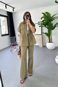 Detail of olive green two-piece linen set featuring drawstring waist and cargo pockets