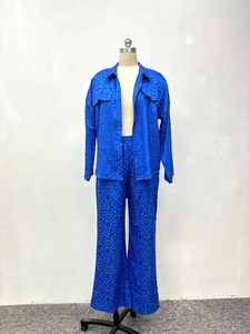 Detail of blue leopard print satin two-piece set featuring long sleeve shirt and pants
