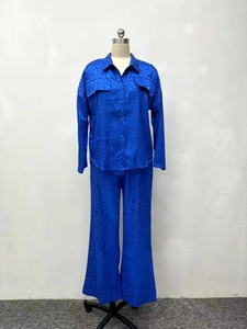 Detailed view of dark blue leopard jacquard satin fabric on long sleeve shirt pockets