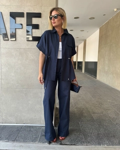 Deep blue two-piece set featuring a short sleeve drawstring shirt and wide-leg cargo pants