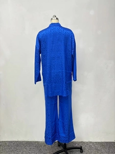 Detail of royal blue satin leopard print loungewear set with glossy fabric texture