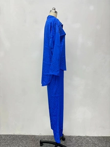 Detail of royal blue leopard jacquard fabric on stylish long sleeve shirt and pants set