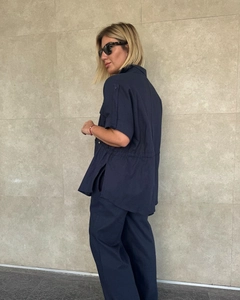Detail of navy blue cargo set showing drawstring waist and breathable cotton fabric