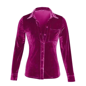 Detail of soft velvet fabric and front pocket on the magenta long sleeve shirt