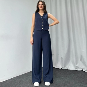 Women dark blue two-piece set featuring tailored vest with gold buttons and wide leg trousers
