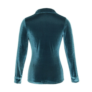 Back view of a long-sleeved peacock blue velvet shirt showing fine tailoring and texture