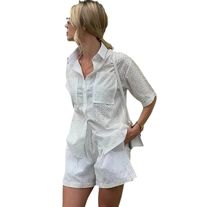 White eyelet lace two-piece set featuring short sleeve shirt and high waist shorts