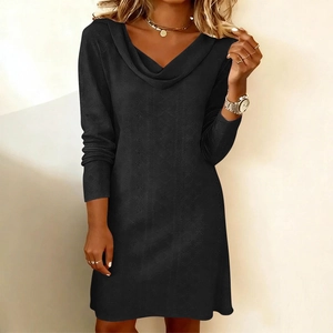 Close-up of the elegant black dress featuring unique hollow textures and a draped cowl neck