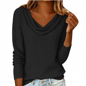 Detail of black cowl neck top featuring delicate hollow-out eyelet embroidery texture