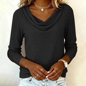 Detail of cowl neck design and eyelet hollow texture on black long sleeve top