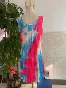 Detailed back view of a sleeveless tie-dye mini dress in vibrant red, blue and white colors