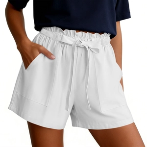 Detail of white paperbag waist shorts with elastic drawstring and large patch pockets