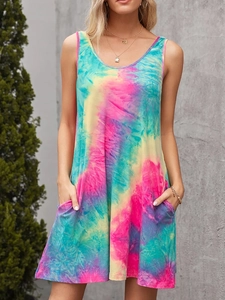 Detail view of colorful tie-dye patterns and practical side pockets on a summer tank dress