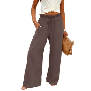 Detail of high waist elastic waistband with drawstring on dark brown wide leg cotton linen pants