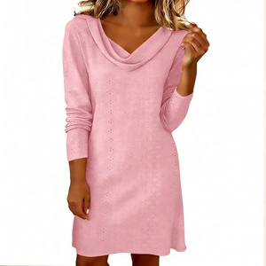 Detail of elegant pink knit dress showing cowl neck and vertical hollow lace pattern
