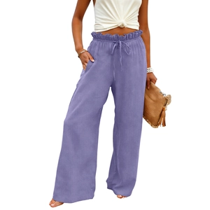 Detail of light purple wide-leg pants with paper-bag waist and functional drawstring
