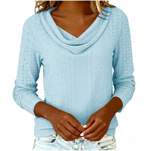 Detail of light blue long sleeve top with hollow-out embroidery and cowl neck style