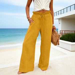 Detail of high waisted ginger cotton linen wide leg trousers with drawstring and pockets
