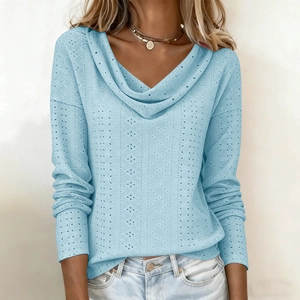 Detail view of light blue cowl neck top featuring delicate hollow-out knit fabric texture