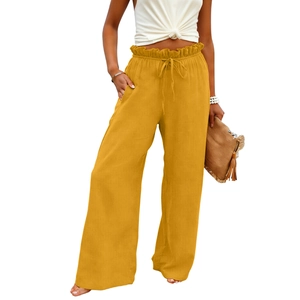 Detail of ruffle elastic high waist with drawstring on mustard cotton linen wide leg pants