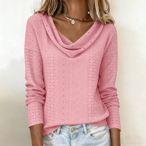 Detail of pink cowl neck top with delicate pointelle knit texture and loose fit style