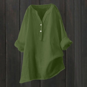 Detailed close-up of army green cotton linen blouse with v-neck and button details