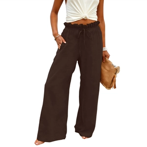 Detail of high waisted wide leg linen trousers with elastic drawstring and ruffle waist