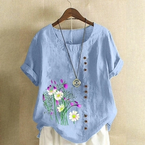 Close-up of linen short-sleeve shirt with floral print and side button details