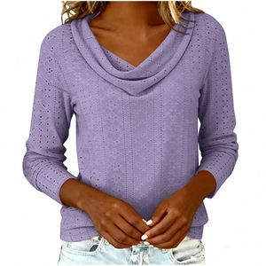 Detail of lavender cowl neck top with intricate geometric eyelet embroidery and long sleeves