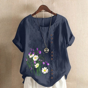 Detail of navy blue cotton linen shirt with floral print and decorative wooden buttons