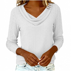 Detail of white long sleeve top featuring V-neck cowl collar and eyelet embroidery texture