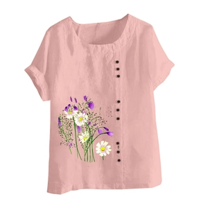 Detail of pink cotton linen blouse showing small front buttons and daisy floral print