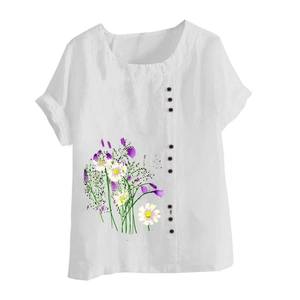 Close-up of white linen short sleeve blouse with floral print and decorative buttons