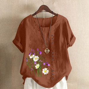 Close-up of brown cotton linen shirt with floral print and wood buttons detail
